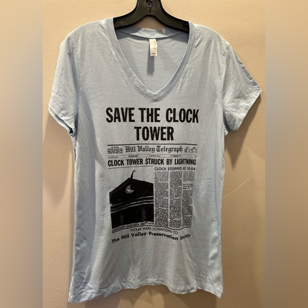Light Blue V-Neck Tee with Black Newspaper Graphic